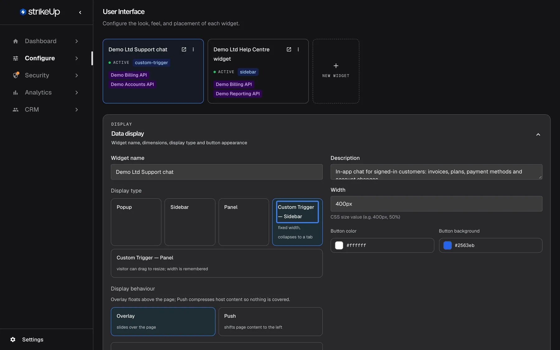 The User Interface page under Configure with the widget card "Demo Ltd Support chat" selected. The Data display section shows Widget name "Demo Ltd Support chat", the description, Width "400px", Button color "#ffffff" and Button background "#2563eb". Under Display type five options are offered: "Popup", "Sidebar", "Panel", the selected and highlighted "Custom Trigger — Sidebar" (fixed width, collapses to a tab) and "Custom Trigger — Panel" (visitor can drag to resize; width is remembered). Below, Display behaviour offers "Overlay" (selected) and "Push". The display type decides how the widget appears on your site.