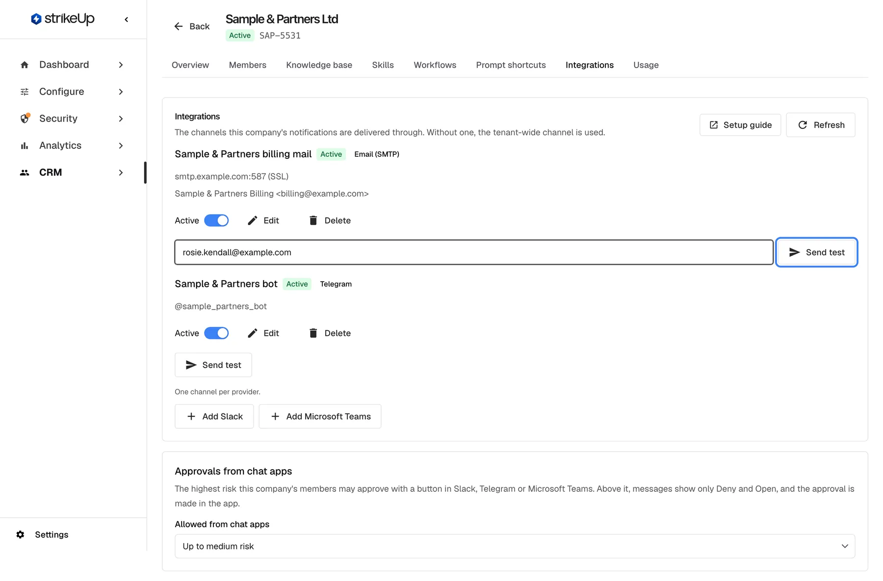 The Integrations tab of "Sample & Partners Ltd": "The channels this company's notifications are delivered through. Without one, the tenant-wide channel is used." Two channels are listed. "Sample & Partners billing mail" (green "Active", "Email (SMTP)") with smtp.example.com:587 (SSL) and "Sample & Partners Billing <billing@example.com>", an "Active" switch, "Edit", "Delete", the test address rosie.kendall@example.com and the highlighted "Send test" button. "Sample & Partners bot" (Active, "Telegram", @sample_partners_bot) has its own "Send test". Below, "One channel per provider." with "Add Slack" and "Add Microsoft Teams", then the card "Approvals from chat apps" with "Allowed from chat apps" set to "Up to medium risk".