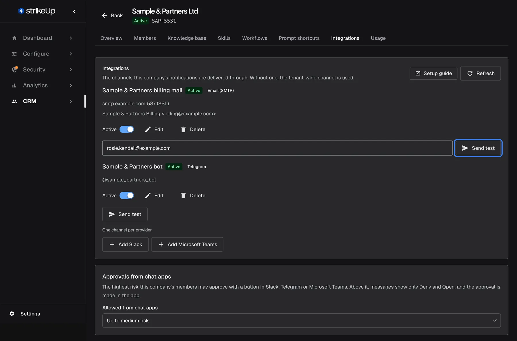 The Integrations tab of "Sample & Partners Ltd": "The channels this company's notifications are delivered through. Without one, the tenant-wide channel is used." Two channels are listed. "Sample & Partners billing mail" (green "Active", "Email (SMTP)") with smtp.example.com:587 (SSL) and "Sample & Partners Billing <billing@example.com>", an "Active" switch, "Edit", "Delete", the test address rosie.kendall@example.com and the highlighted "Send test" button. "Sample & Partners bot" (Active, "Telegram", @sample_partners_bot) has its own "Send test". Below, "One channel per provider." with "Add Slack" and "Add Microsoft Teams", then the card "Approvals from chat apps" with "Allowed from chat apps" set to "Up to medium risk".