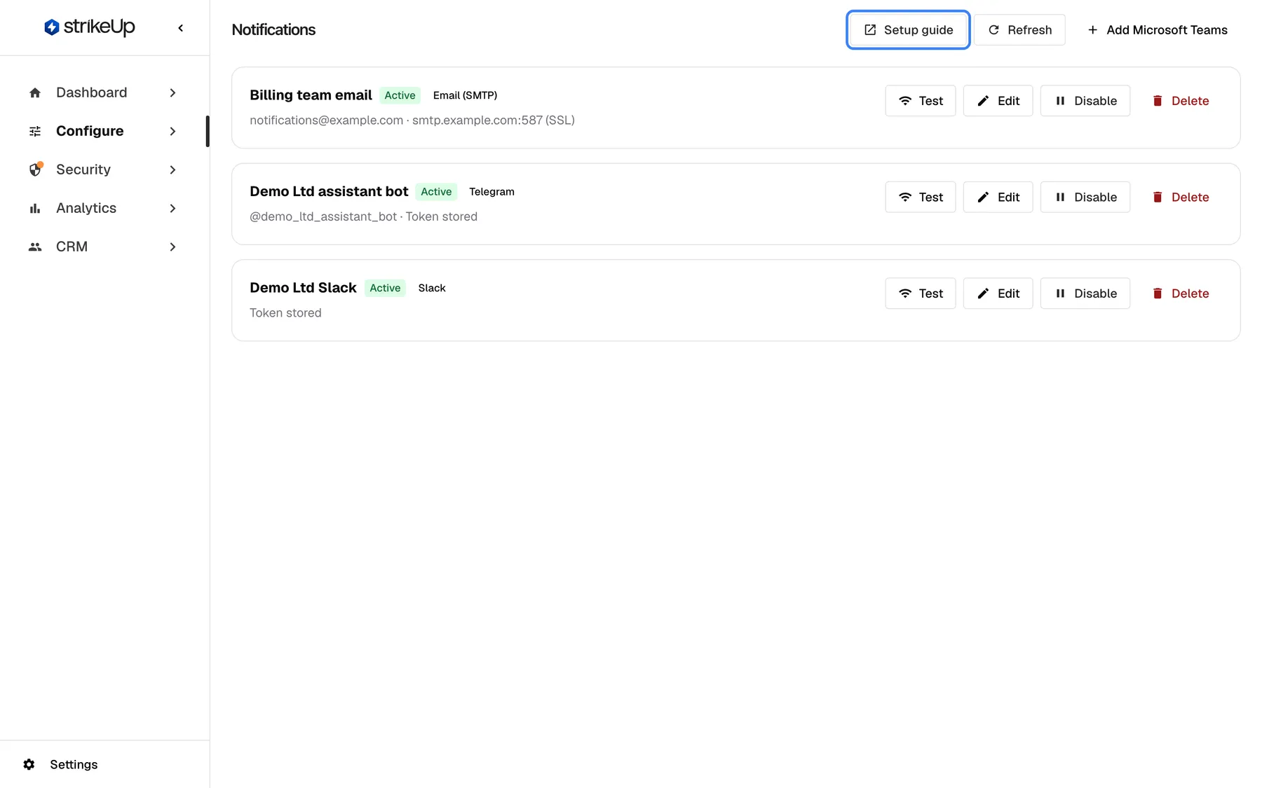 The Notifications page under Configure with the workspace's three channels: "Billing team email" (Active, Email (SMTP), notifications@example.com · smtp.example.com:587 (SSL)), "Demo Ltd assistant bot" (Active, Telegram, @demo_ltd_assistant_bot · Token stored) and "Demo Ltd Slack" (Active, Slack, Token stored), each with "Test", "Edit", "Disable" and "Delete". At the top right are the highlighted "Setup guide" link, which opens the Notification Channels setup guide in a new tab, "Refresh" and "Add Microsoft Teams".