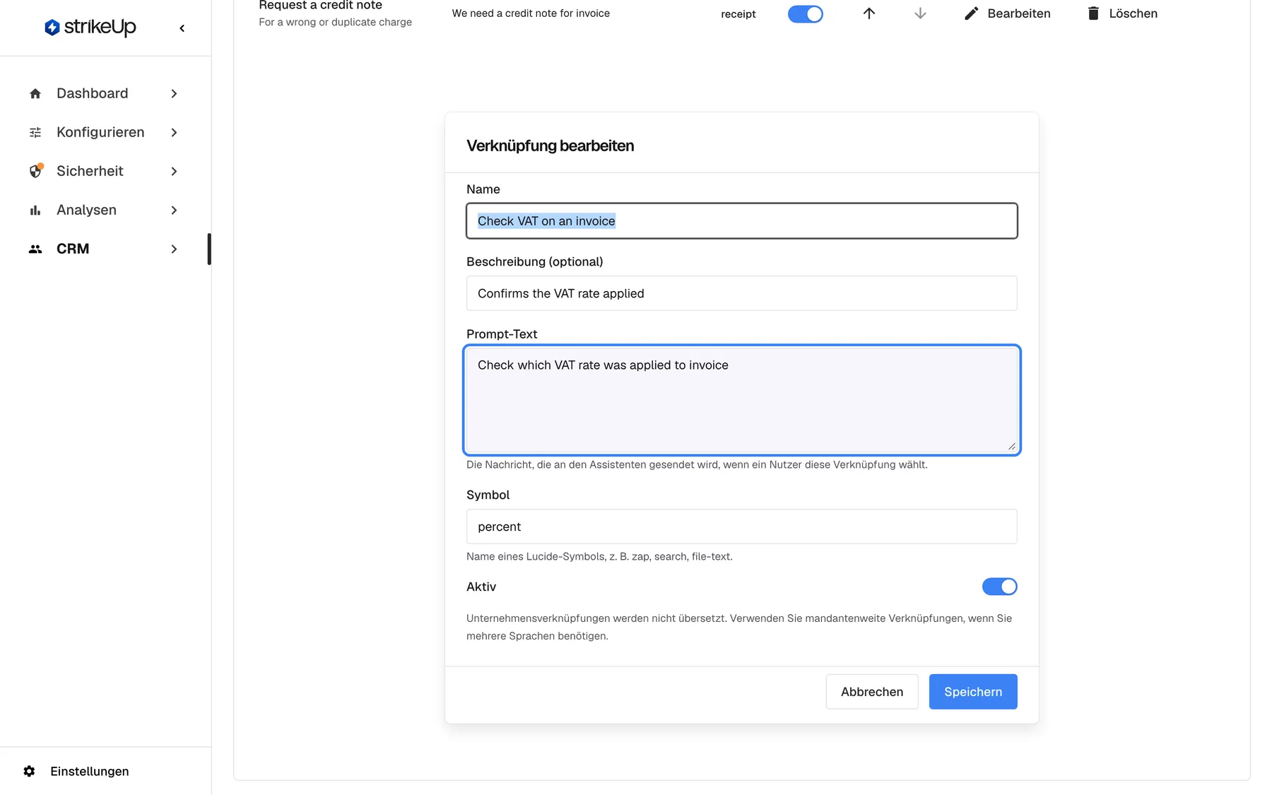 Der Dialog „Verknüpfung bearbeiten“ für „Check VAT on an invoice“, unterhalb der Tabelle. Er enthält „Name“, „Beschreibung (optional)“ mit „Confirms the VAT rate applied“, das hervorgehobene Feld „Prompt-Text“ mit „Check which VAT rate was applied to invoice“, „Symbol“ mit percent und dem Hinweis auf Lucide-Symbolnamen sowie den Schalter „Aktiv“. Abbrechen und Speichern schließen den Dialog.