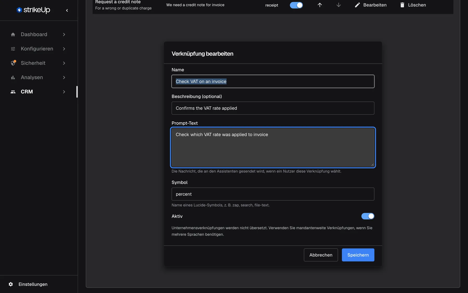 Der Dialog „Verknüpfung bearbeiten“ für „Check VAT on an invoice“, unterhalb der Tabelle. Er enthält „Name“, „Beschreibung (optional)“ mit „Confirms the VAT rate applied“, das hervorgehobene Feld „Prompt-Text“ mit „Check which VAT rate was applied to invoice“, „Symbol“ mit percent und dem Hinweis auf Lucide-Symbolnamen sowie den Schalter „Aktiv“. Abbrechen und Speichern schließen den Dialog.