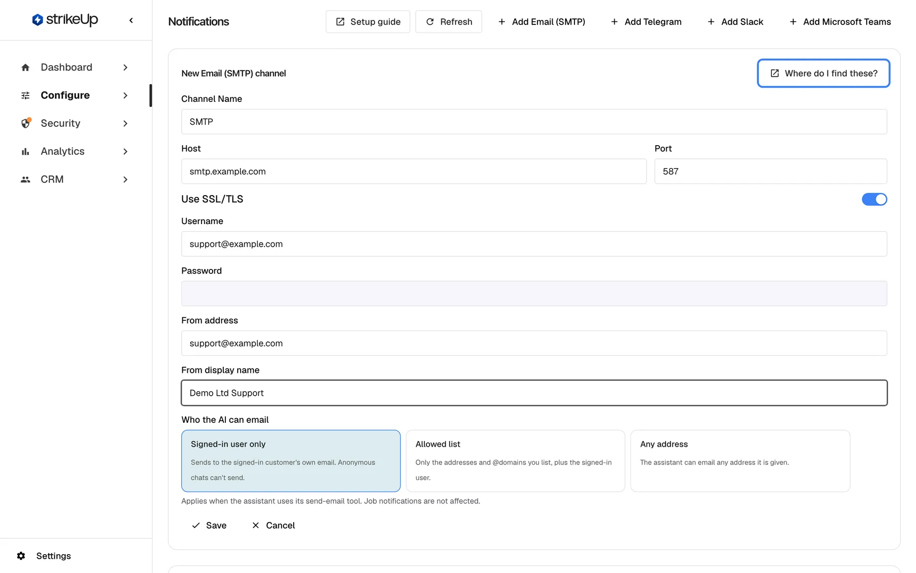 The Notifications page with the "New Email (SMTP) channel" form open above the empty list. "Channel Name" reads "SMTP", "Host" "smtp.example.com", "Port" "587" and "Use SSL/TLS" is on; "Username" and "From address" read "support@example.com", "From display name" "Demo Ltd Support", and "Password" is still empty. At the top right of the form the highlighted link "Where do I find these?" opens the SMTP part of the setup guide in a new tab. "Save" and "Cancel" are below the fields.