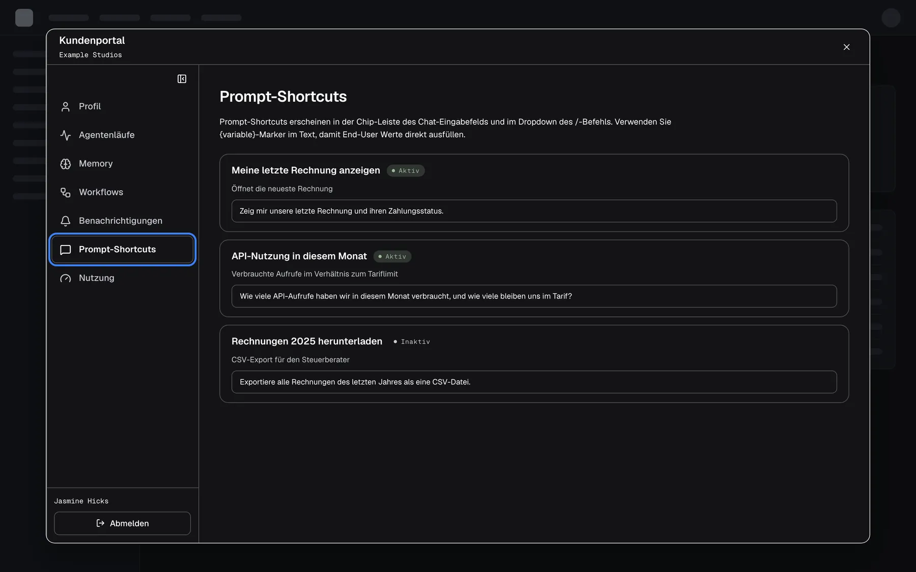 Das Kundenportal aus Sicht von Jasmine Hicks, Mitglied von "Example Studios". Ihre Seitenleiste hat nur Profil, Agentenläufe, Memory, Workflows, Benachrichtigungen, die hervorgehobenen und ausgewählten "Prompt-Shortcuts" und Nutzung; Mitglieder, Wissensdatenbank, Fähigkeiten und Einstellungen fehlen. Die Seite Prompt-Shortcuts listet die Shortcuts des Unternehmens schreibgeschützt: "Meine letzte Rechnung anzeigen" und "API-Nutzung in diesem Monat" (aktiv) sowie "Rechnungen 2025 herunterladen" (inaktiv), jeweils mit Beschreibung und Prompt-Text.