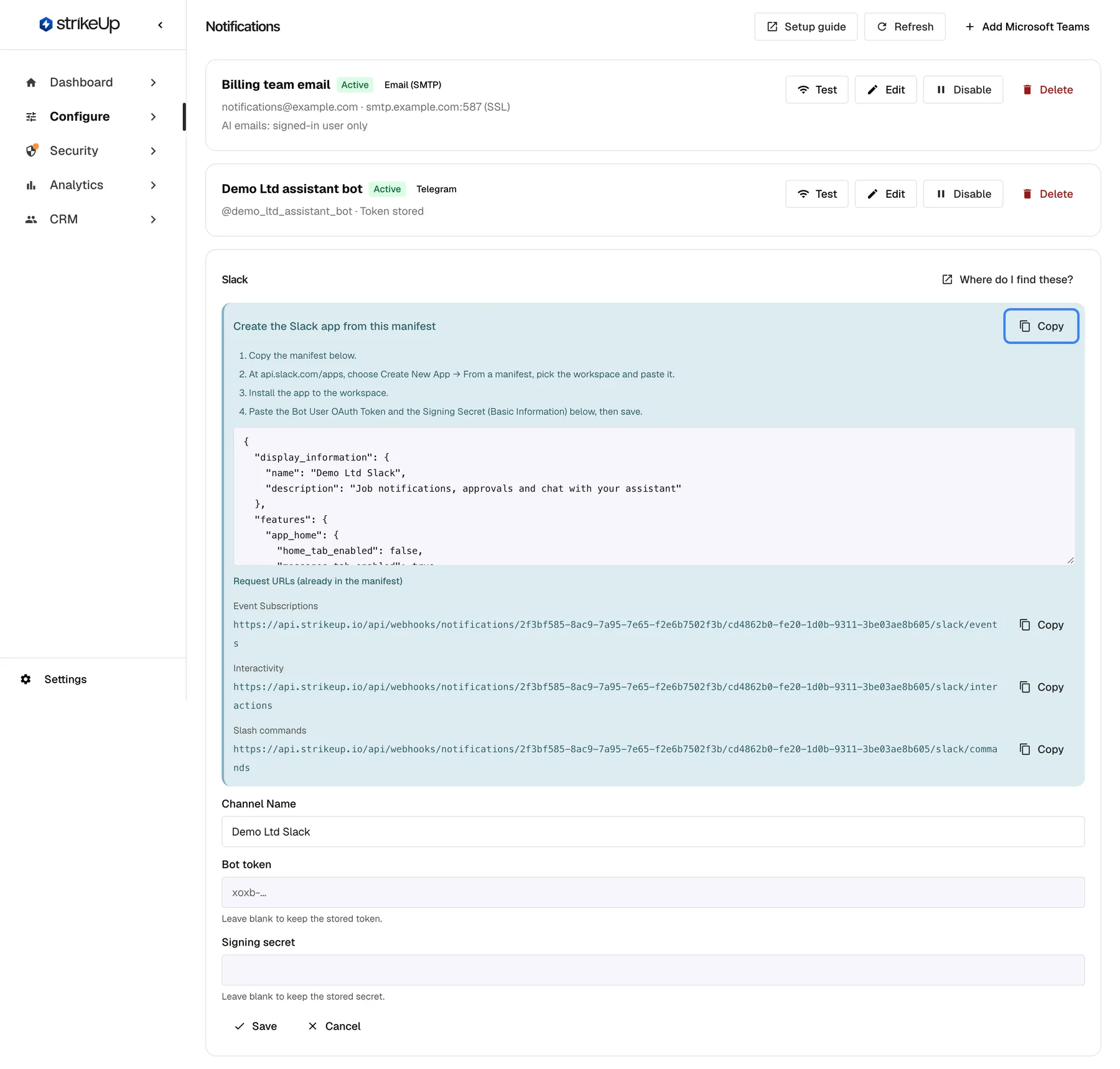 The Slack channel "Demo Ltd Slack" opened for editing. At the top a blue panel, "Create the Slack app from this manifest", lists four steps: copy the manifest, create the app at api.slack.com/apps from a manifest, install it to the workspace, then paste the Bot User OAuth Token and the Signing Secret and save. The highlighted "Copy" button copies the manifest shown in the box below it. Under "Request URLs (already in the manifest)" follow the Event Subscriptions, Interactivity and Slash commands addresses, each with "Copy". Below are "Channel Name", "Bot token" and "Signing secret", both empty with the hint to leave them blank to keep the stored values.