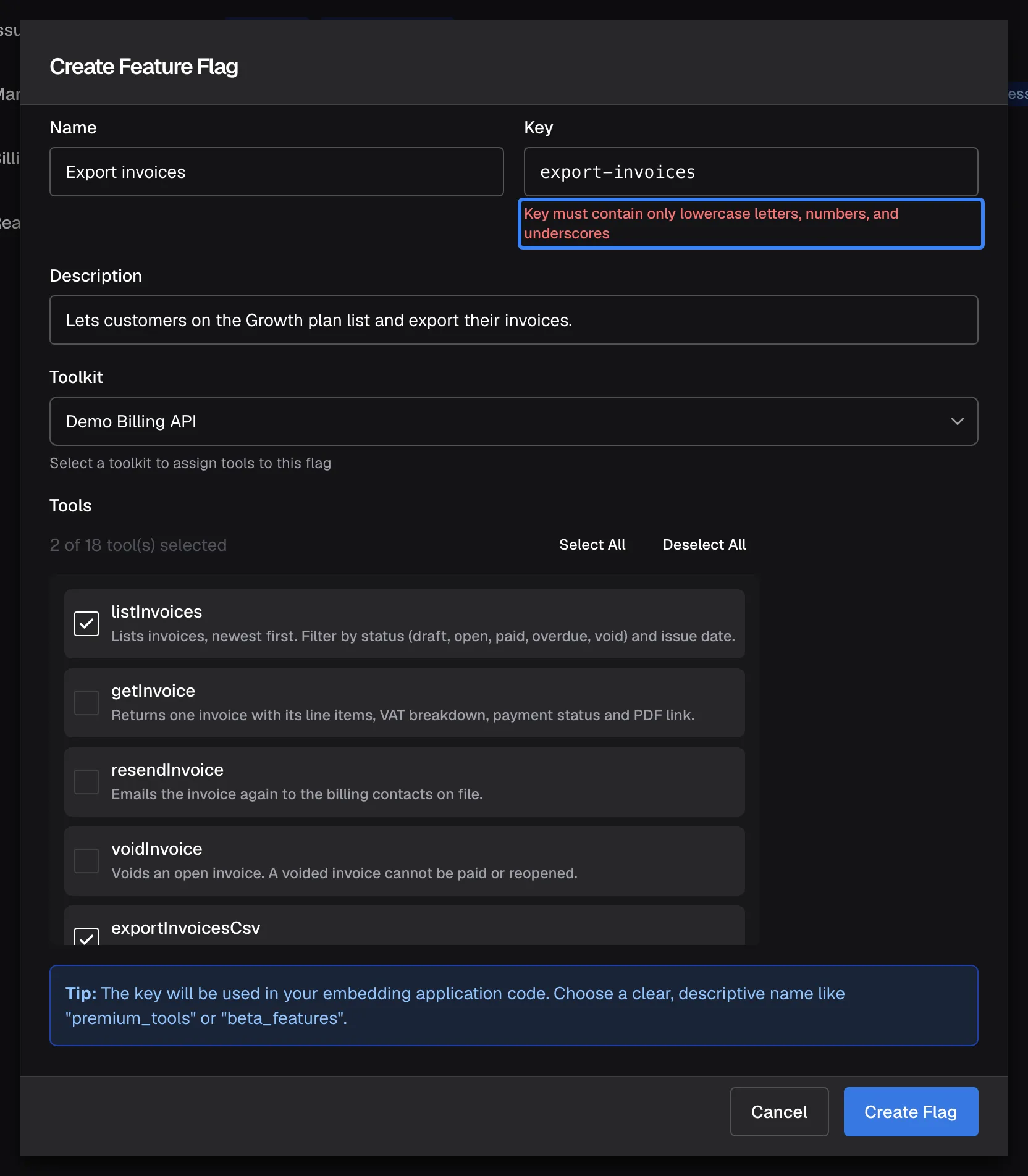 The "Create Feature Flag" dialog after "Create Flag" was pressed with the key export-invoices. The "Key" field is marked red and the highlighted message below it reads "Key must contain only lowercase letters, numbers, and underscores". Name, description, toolkit and the two ticked tools are unchanged. Nothing was saved; replacing the hyphen with an underscore makes the key valid.