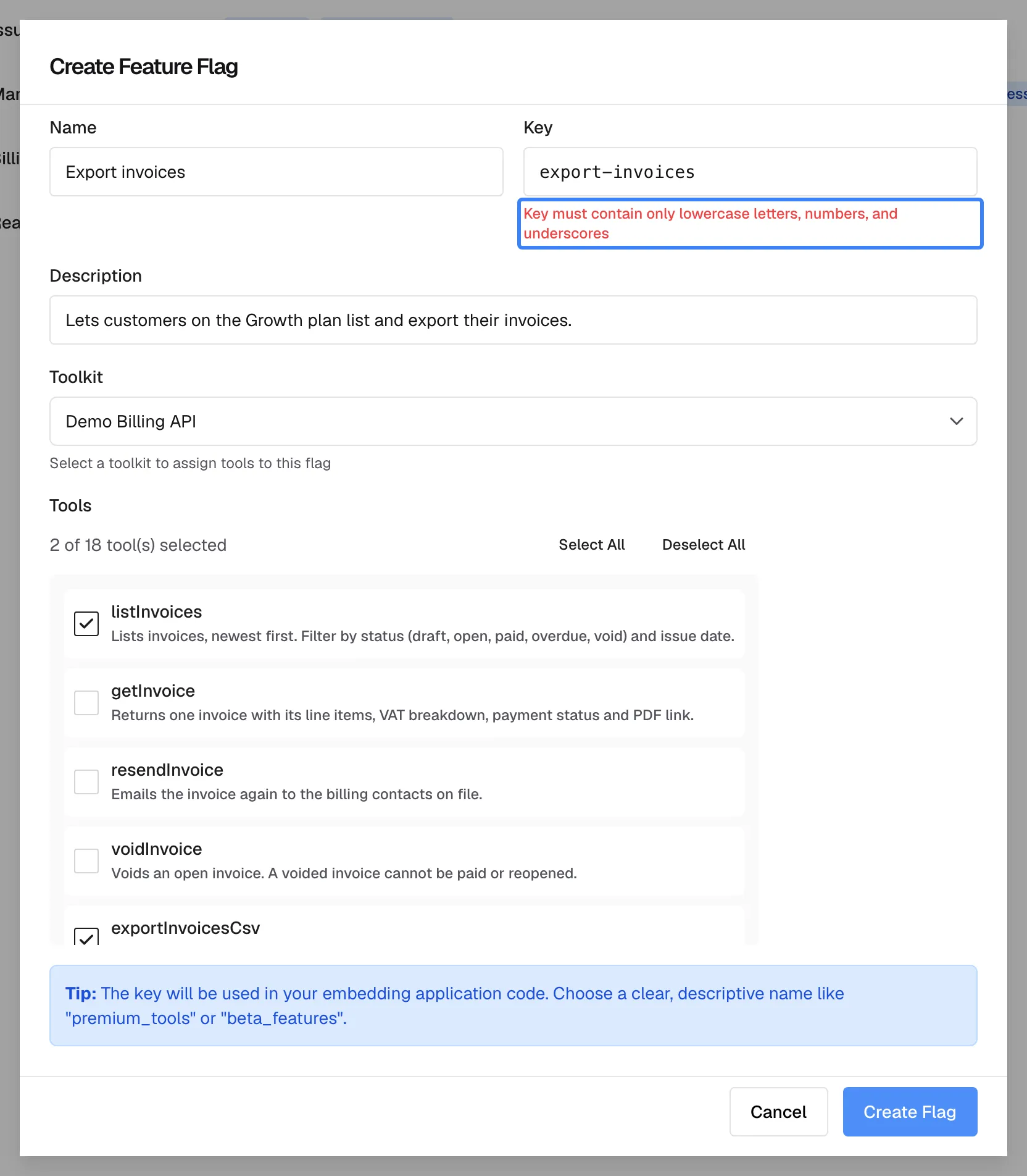 The "Create Feature Flag" dialog after "Create Flag" was pressed with the key export-invoices. The "Key" field is marked red and the highlighted message below it reads "Key must contain only lowercase letters, numbers, and underscores". Name, description, toolkit and the two ticked tools are unchanged. Nothing was saved; replacing the hyphen with an underscore makes the key valid.
